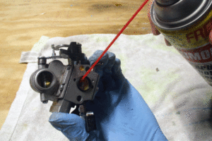 Clean the carburetor to solve chainsaw starting problems. 